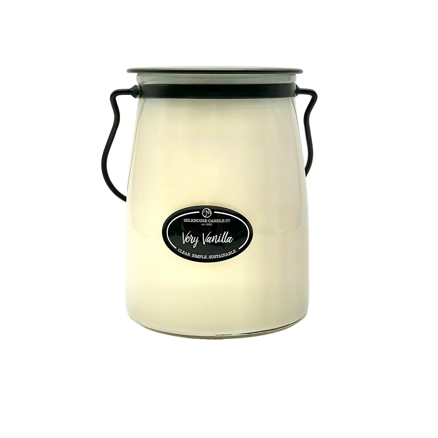 White candle jar with black label on a white background