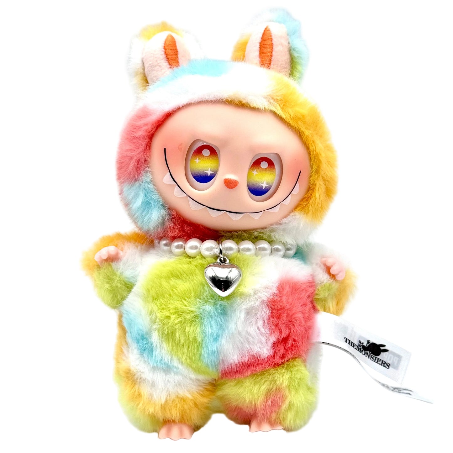 Colorful plush toy with rainbow eyes and a heart-shaped tag on a white background