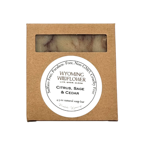 Wyoming Wildflower soap bar in a brown cardboard box with a label on a white background