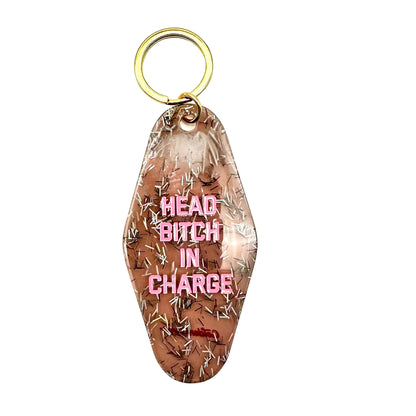 Keychain with 'HEAD BITCH IN CHARGE' text on a white background