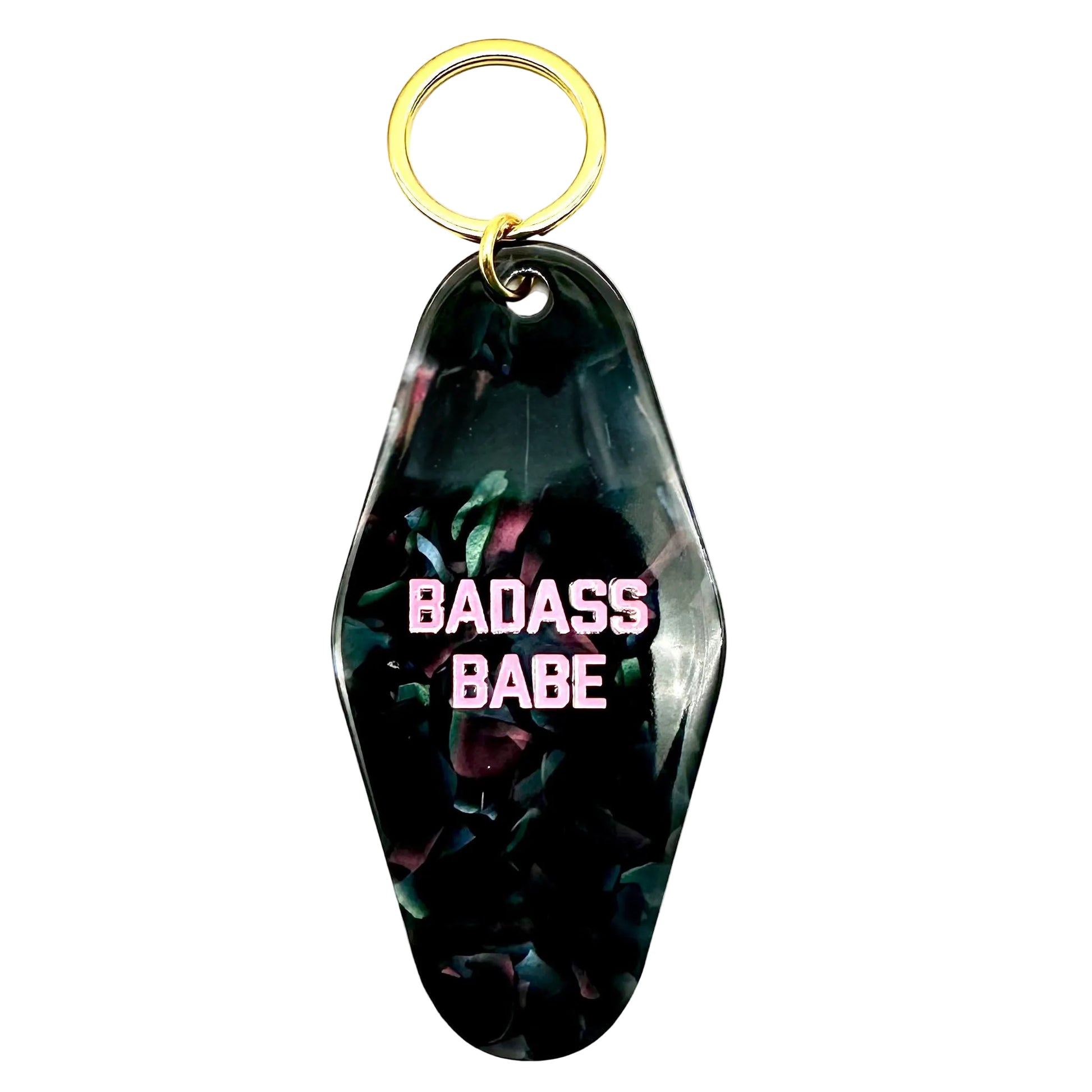 Keychain with 'BADASS BABE' text on a dark floral background
