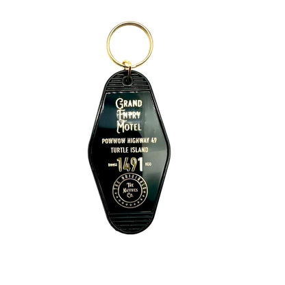 Black Keychain with 'Grand Trunk Motel' text on a white background