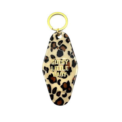 Leopard print keychain with 'Gutsy Little Lady' text on a white background