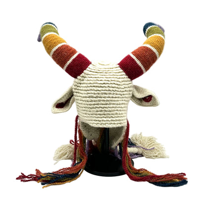 Knitted goat hat with colorful horns on a mannequin head against a white background