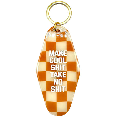Checkered keychain with text on a white background