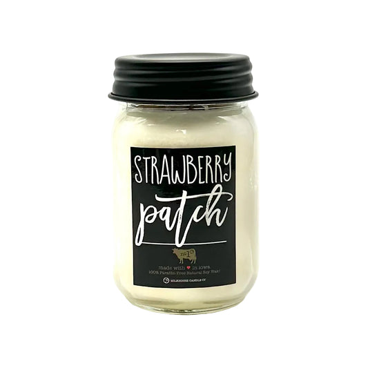 Candle jar with 'Strawberry Patch' label on a white background