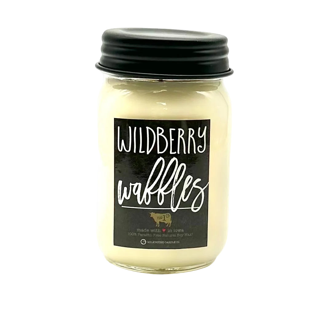Jar of candle labeled 'Wildberry Waffles' on a white background