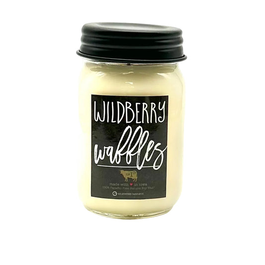 Jar of candle labeled 'Wildberry Waffles' on a white background