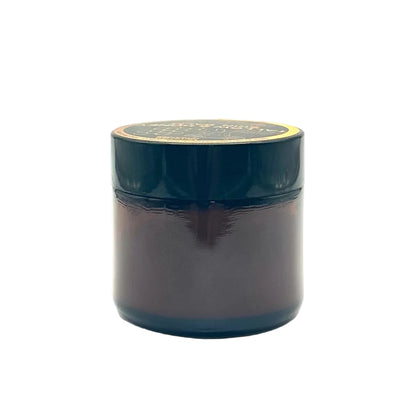 Dark blue jar with a gold lid on a white background