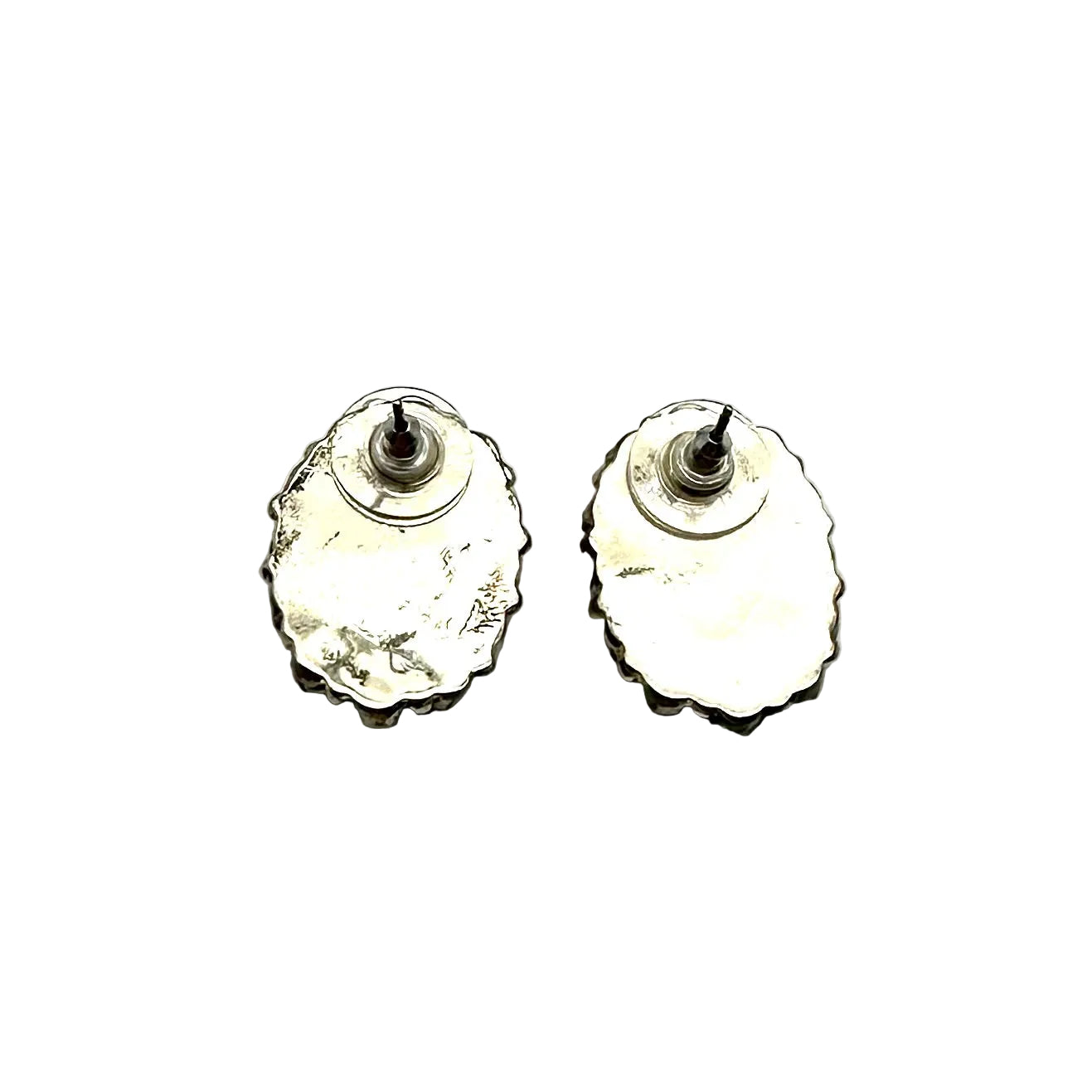 Pair of silver earrings on a white background
