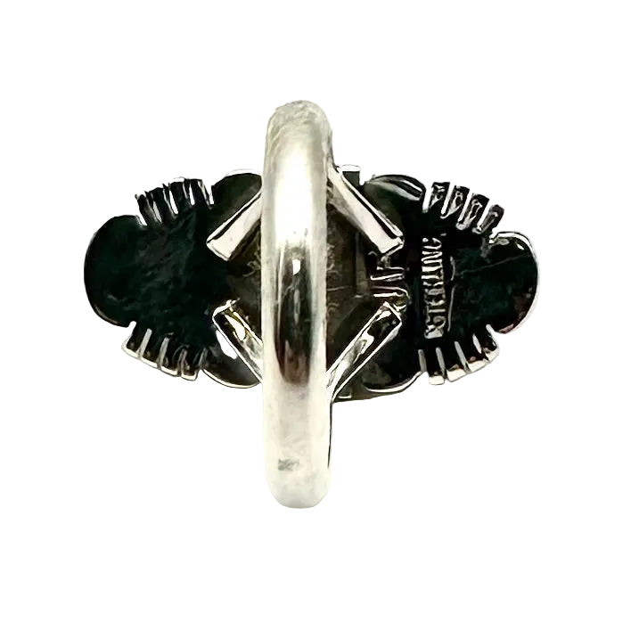 Silver ring with black stones on a white background