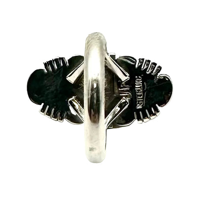 Silver ring with black stones on a white background