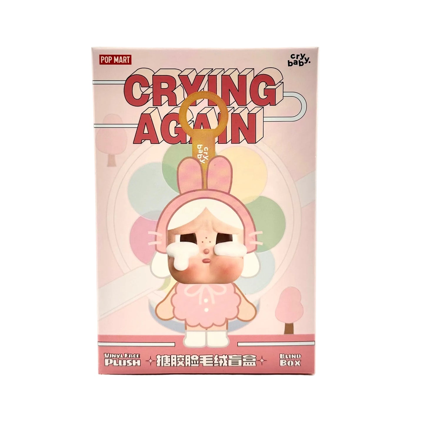 A pink 'Crying Again' plush toy mystery box by Pop Mart, featuring a cartoon rabbit character with tears and a gold keyhole charm, shown on a plain white background.