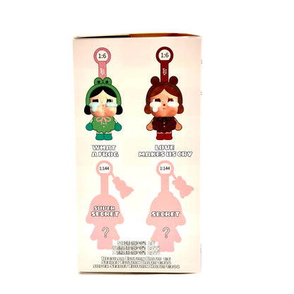 A blind box for a collectible figure, featuring illustrations of two characters on the front: 'White Aling' in a green frog outfit and 'Little Minnie Day' in a brown dress, alongside pink silhouette placeholders for a 'Slept Secret' figure and a 'Secret' figure.