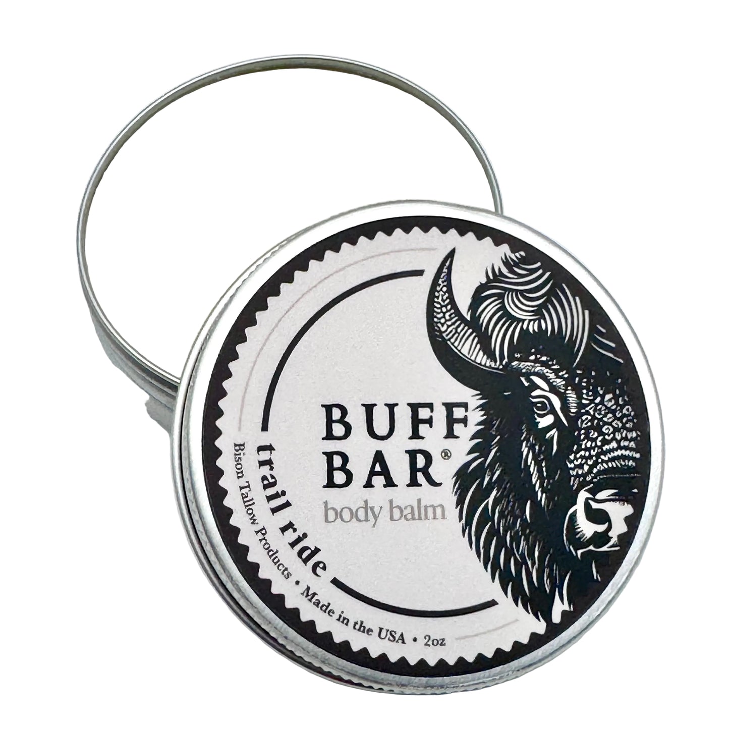 Buff Bar body balm in a metal tin with a black and white label on a light gray background